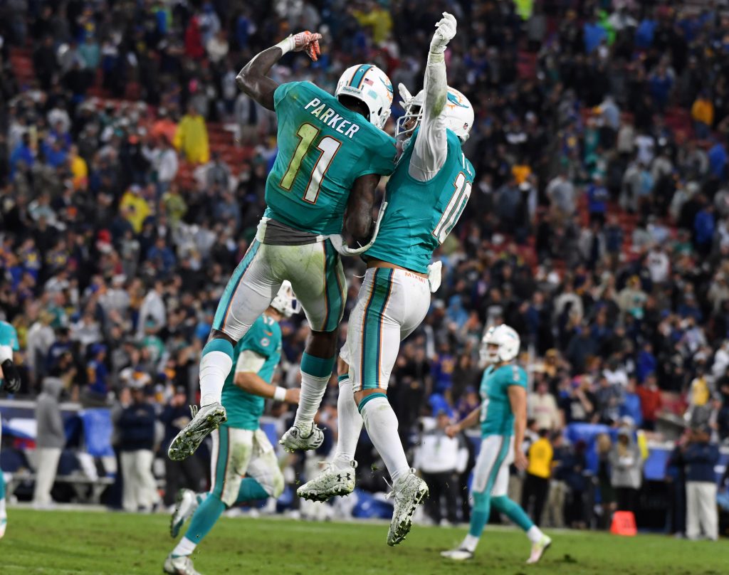 Nov 20, 2016; Los Angeles, CA, USA; Miami Dolphins wide receiver DeVante Parker (11) celebrates with Miami wide receiver Kenny Stills (10) after scoring on a 9-yard touchdown pass with 36 seconds left against the Los Angeles Rams during a NFL football game at Los Angeles Memorial Coliseum. The Dolphins defeated the Rams 14-10. Mandatory Credit: Kirby Lee-USA TODAY Sports