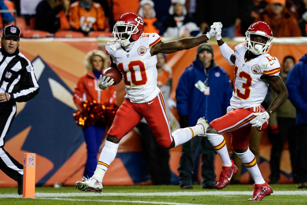 Nov 27, 2016; Denver, CO, USA; Kansas City Chiefs wide receiver Tyreek Hill (10) celebrates a touchdown with wide receiver De'Anthony Thomas (13) in the second quarter against the Denver Broncos at Sports Authority Field at Mile High. Mandatory Credit: Isaiah J. Downing-USA TODAY Sports