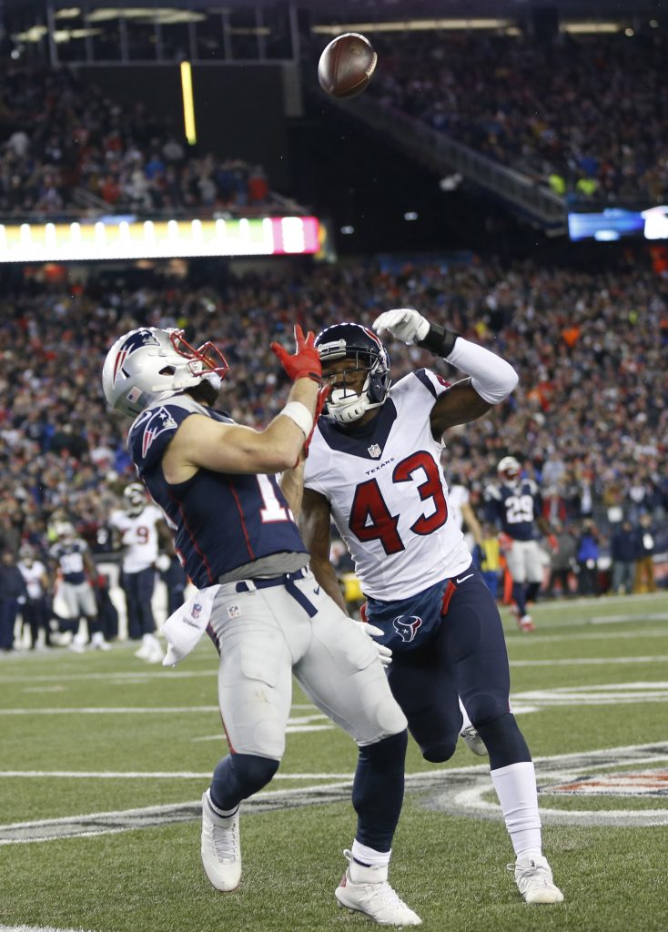 Jan 14, 2017; Foxborough, MA, USA; New England Patriots wide receiver Julian Edelman (11) cannot catch a pass against Houston Texans strong safety Corey Moore (43) in the second half in the AFC Divisional playoff game at Gillette Stadium. Mandatory Credit: Greg M. Cooper-USA TODAY Sports