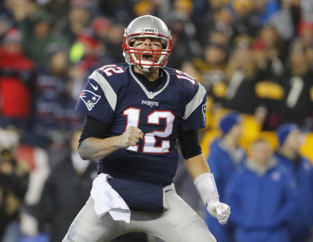 Jan 22, 2017; Foxborough, MA, USA; New England Patriots quarterback Tom Brady (12) celebrates after a touchdown by running back LeGarrette Blount (not pictured) against the Pittsburgh Steelers during the third quarter in the 2017 AFC Championship Game at Gillette Stadium. Mandatory Credit: Winslow Townson-USA TODAY Sports