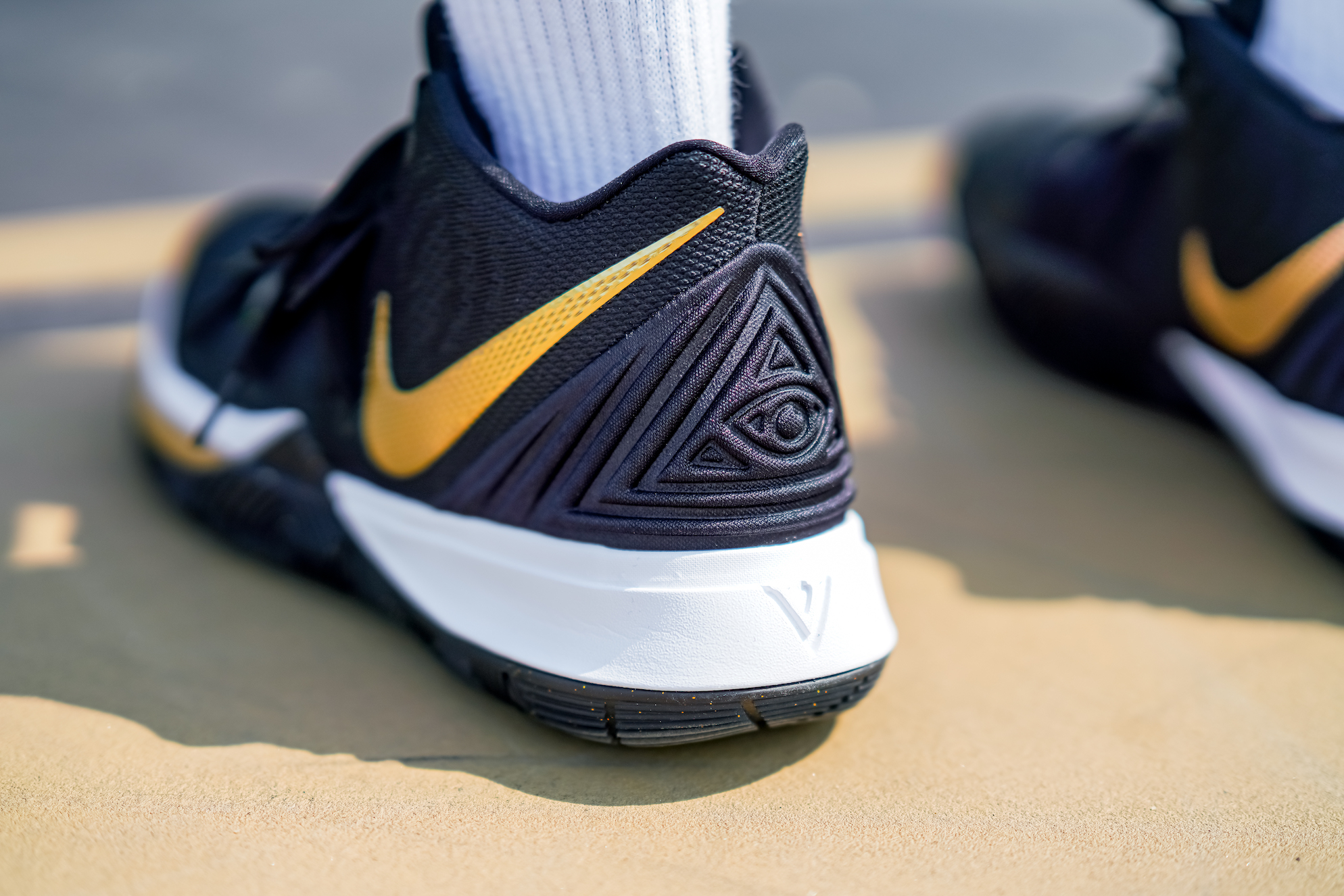 kyrie shoes gold and black